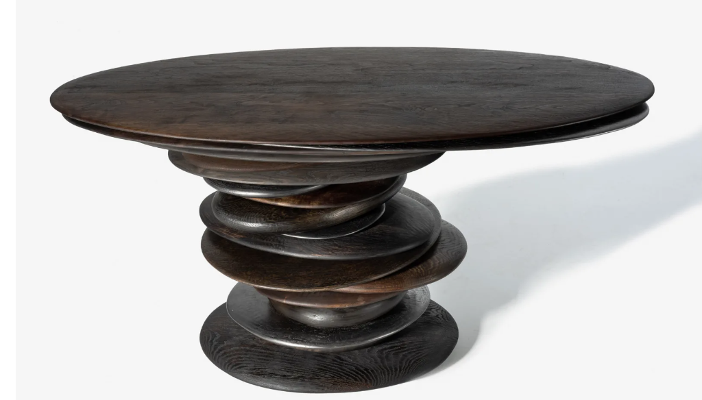 Round table with a pedestal made of other round discs
