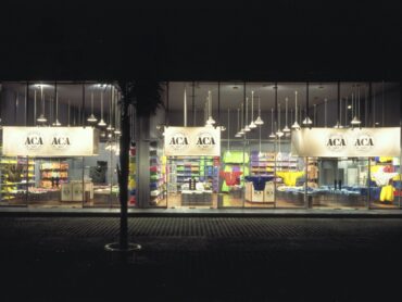 A store front with many lights and windows