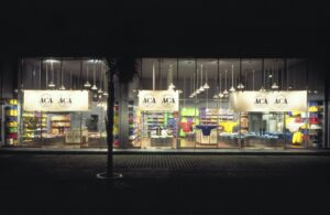 A store front with many lights and windows